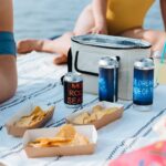 Food, Cold Drinks and Thermal Bag on Picnic