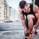 man tying his shoes