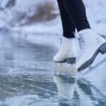 a person is skating on a frozen lake