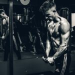 grayscale photo of man exercising